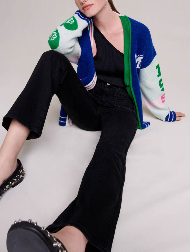 Black jeans, braided finishes on pockets