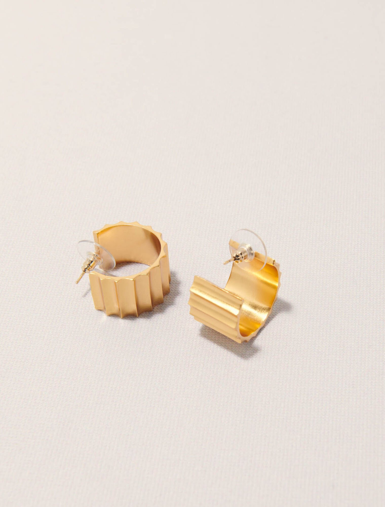 Tapered gold mini hoop earrings