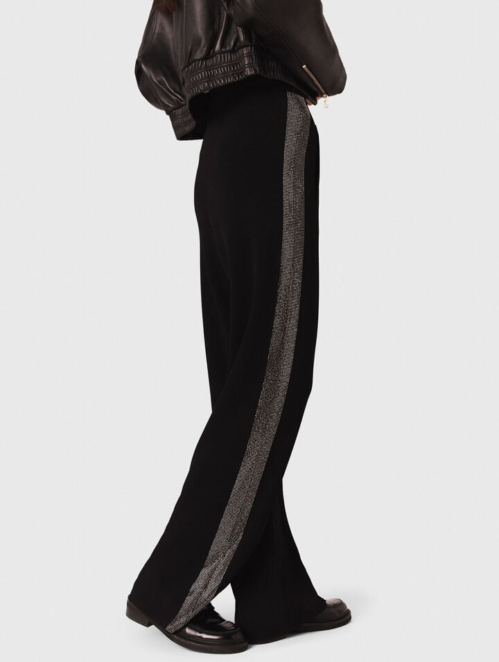 Trousers with rhinestone band