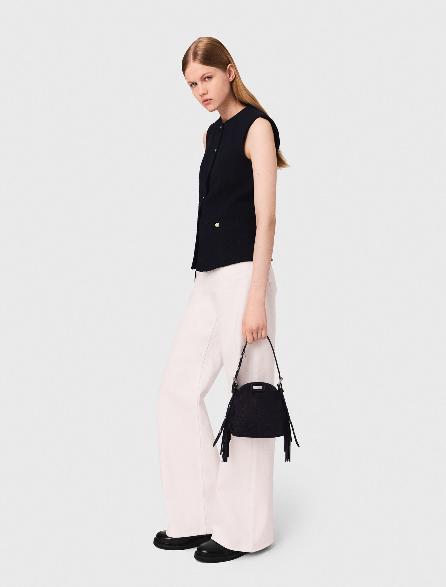 Long sleeveless tweed jacket