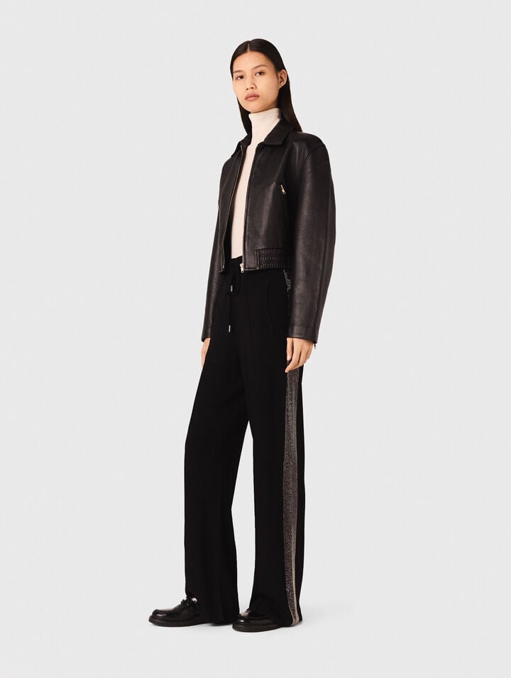 Trousers with rhinestone band
