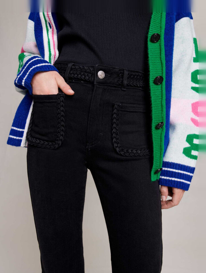 Black jeans, braided finishes on pockets