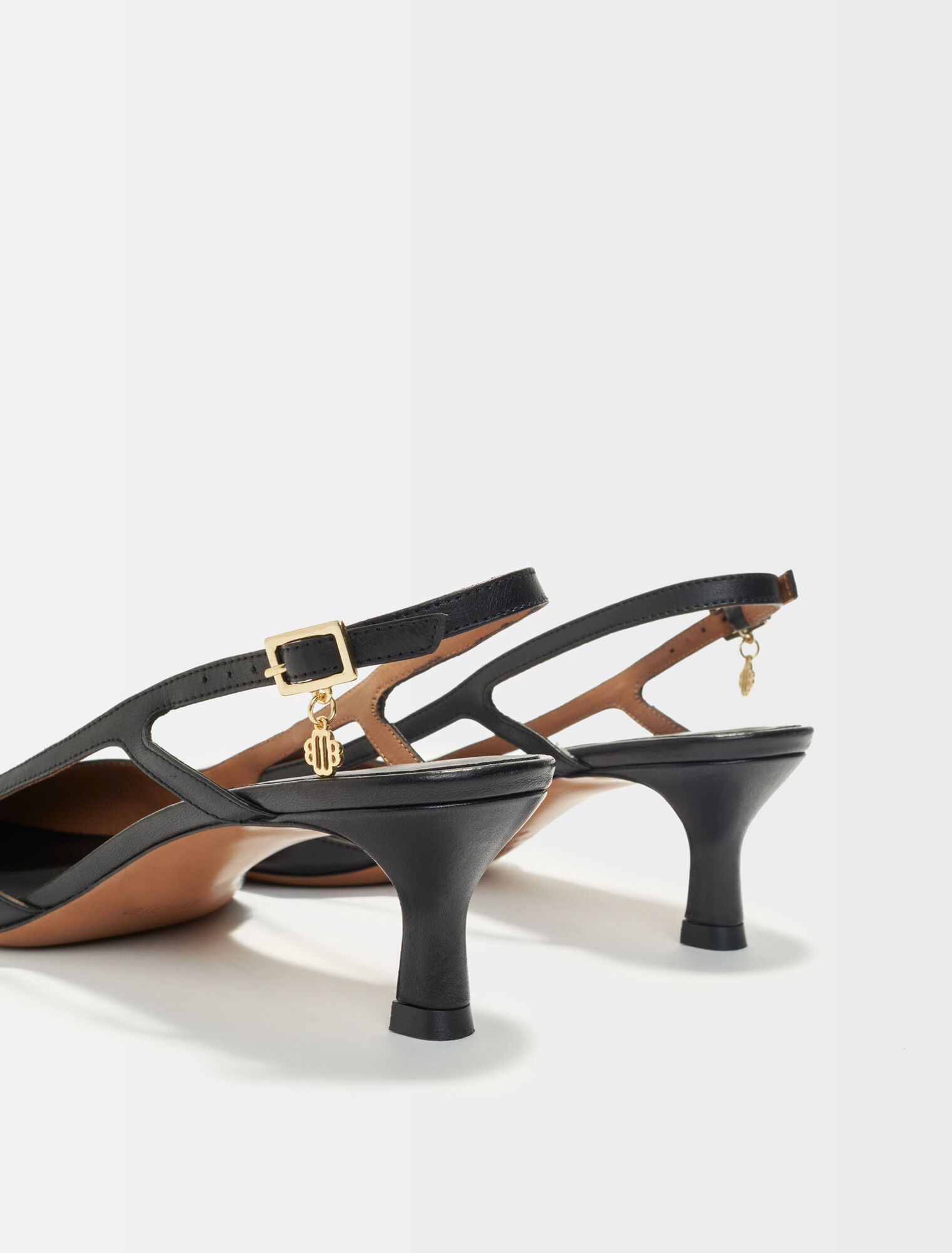 Pointed-toe pumps with straps