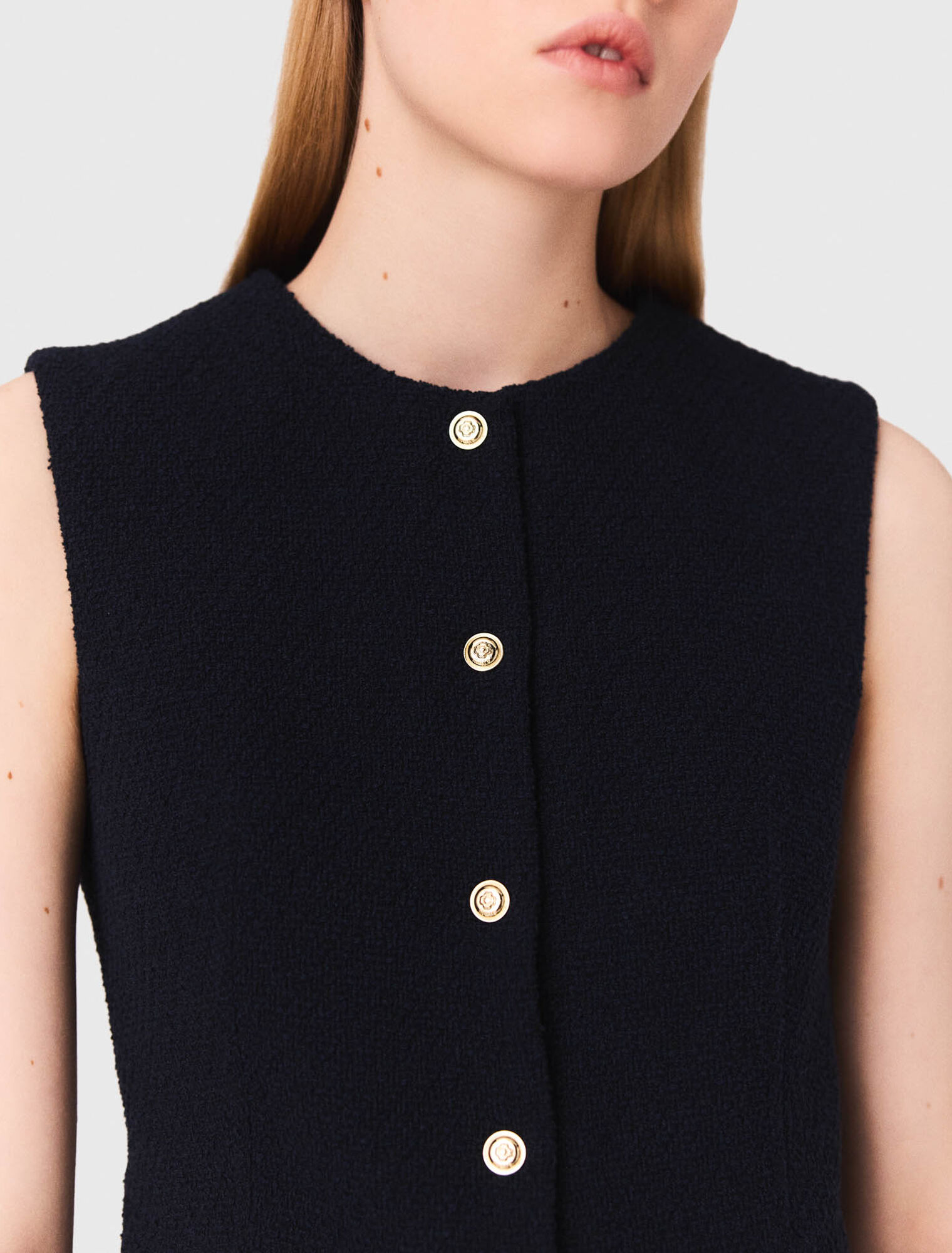 Long sleeveless tweed jacket