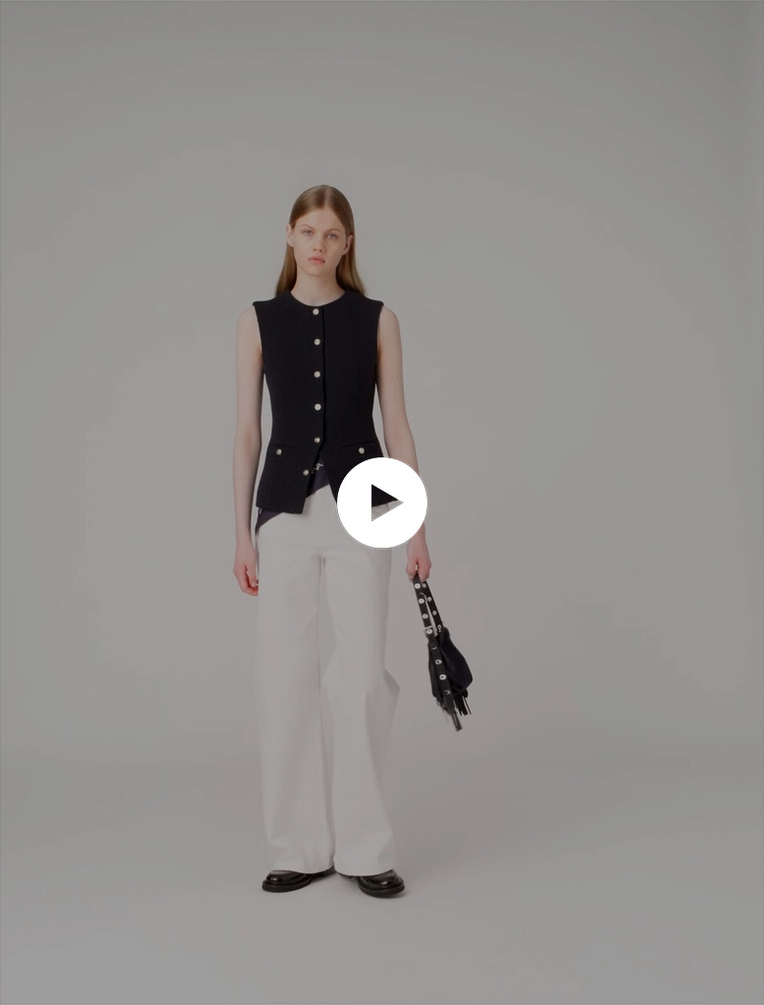 Long sleeveless tweed jacket