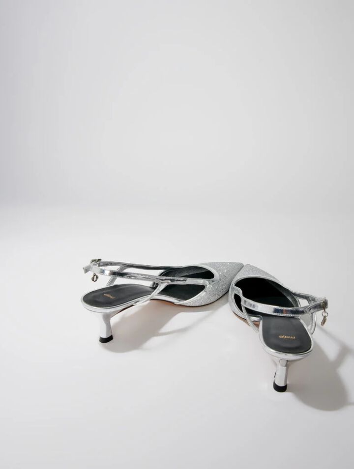 Pointed silver pumps