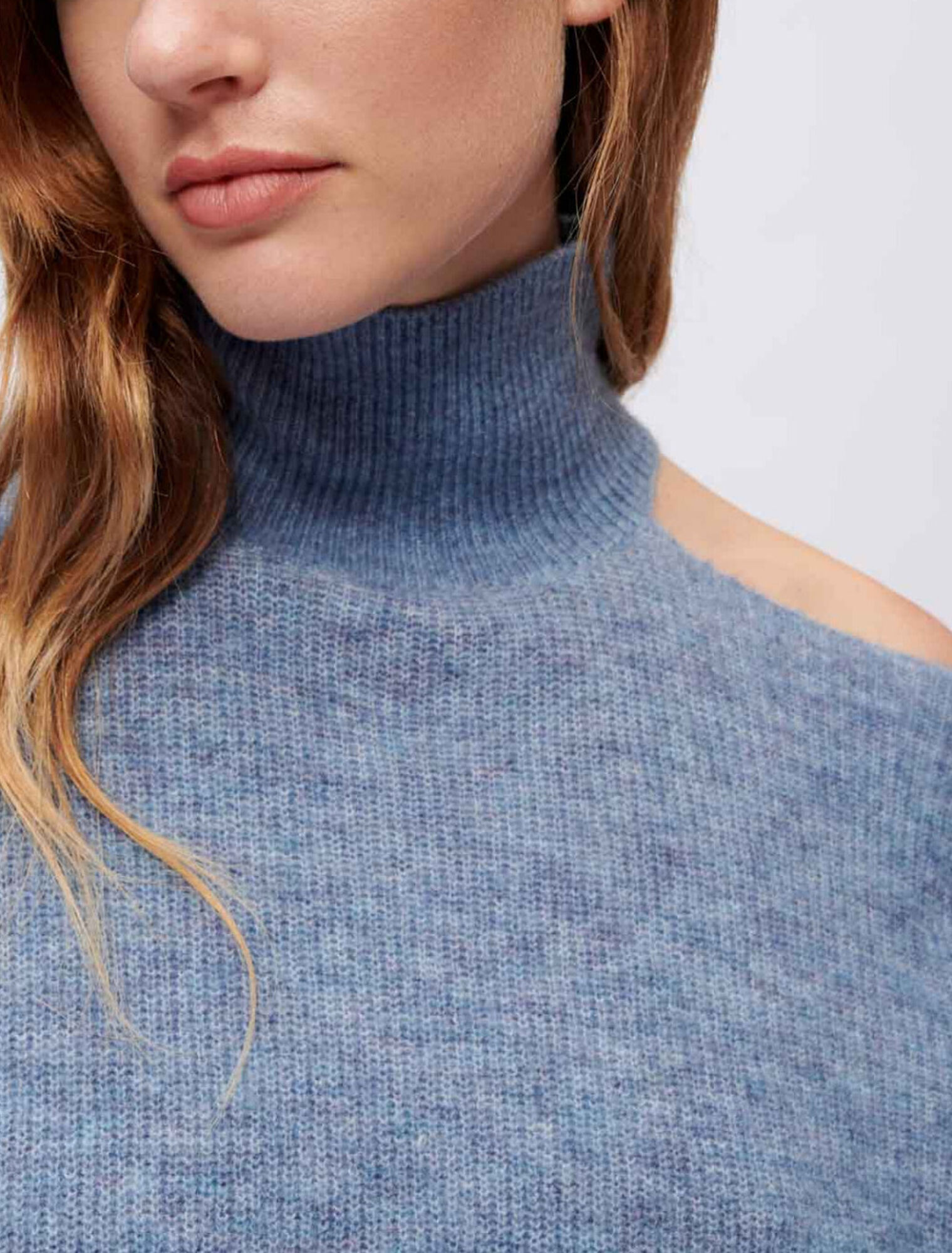High-neck sweater with open shoulder